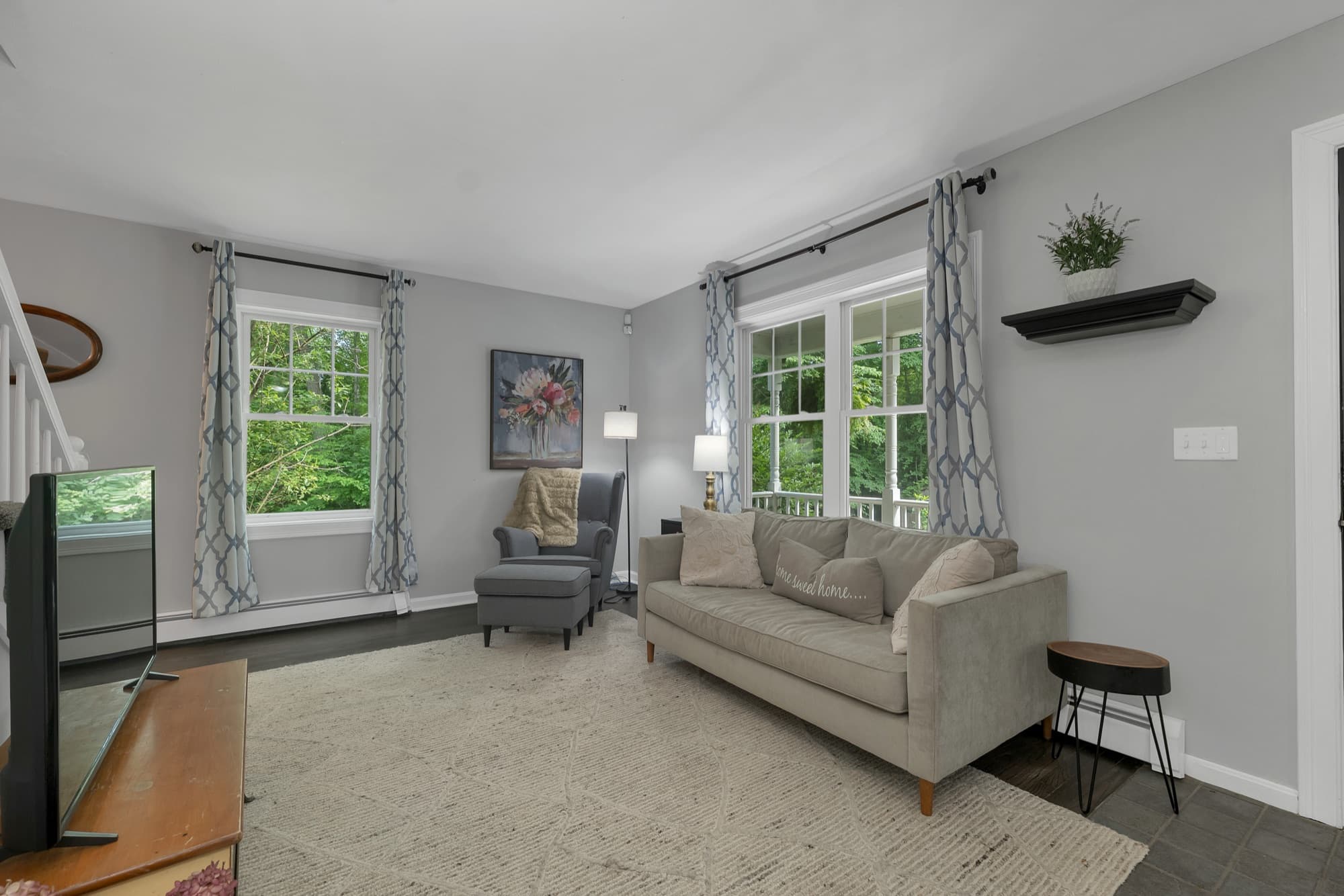 Living room with wide windows onto the trees